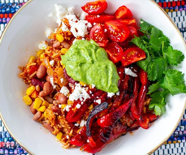 vegetarian burrito bowl with avocado crema